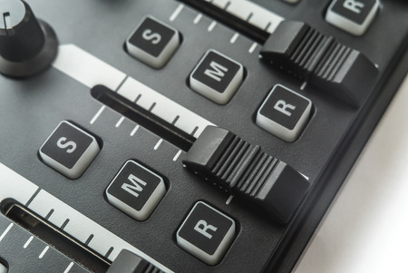 Photo of the analog audio mixer of the sound producer close up