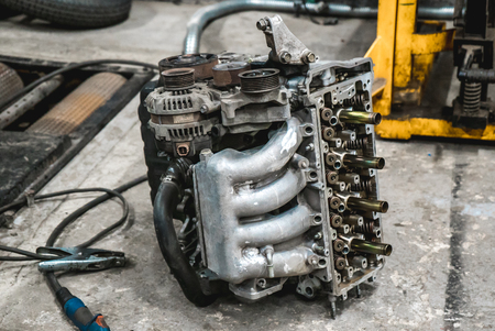 The bright photo of the disassembled car internal combustion engine