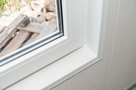 The photo of the established new white window sill indoors