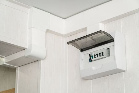 The photo of a white plastic electric guard on a white wallの写真素材
