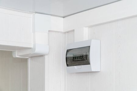 The photo of a white plastic electric guard on a white wallの写真素材