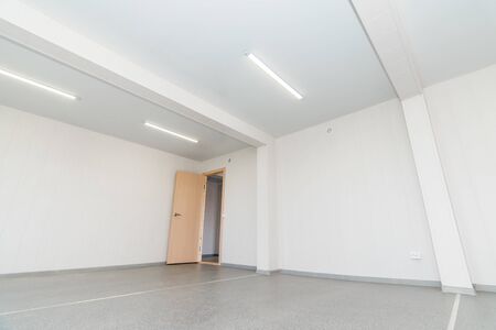 The photo of light white empty office room with bright lightingの写真素材