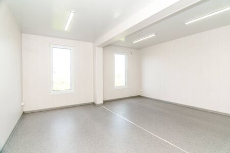 The photo of light white empty office room with bright lightingの写真素材