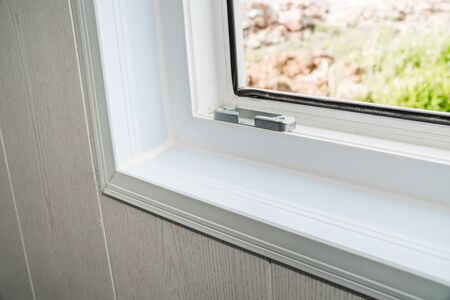 The photo of the established new white window sill indoorsの写真素材
