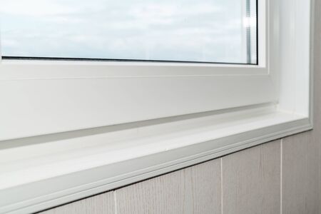 The photo of the established new white window sill indoorsの写真素材