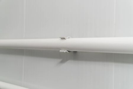 The photo of the established plastic pipes for water supply in the puplichny bathroomの写真素材