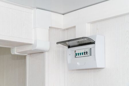 The photo of a white plastic electric guard on a white wallの写真素材