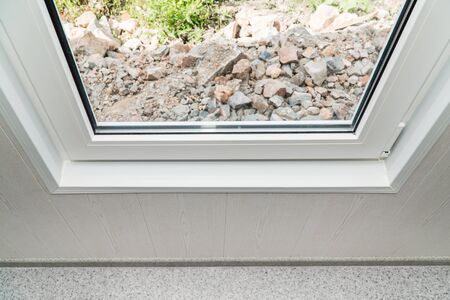 The photo of the established new white window sill indoorsの写真素材