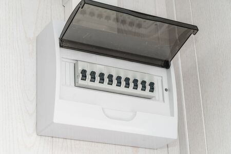 The photo of a white plastic electric guard on a white wallの写真素材