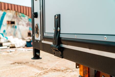 The photo of a black door loop on a white door of the truck