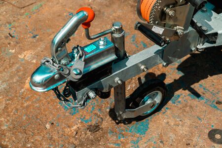 Photograph of hand winch made of steel on trailer with wheel close-upの写真素材