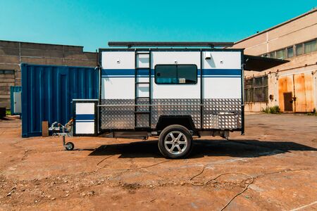 Photo of white makeshift house on wheels taken from trailerの写真素材
