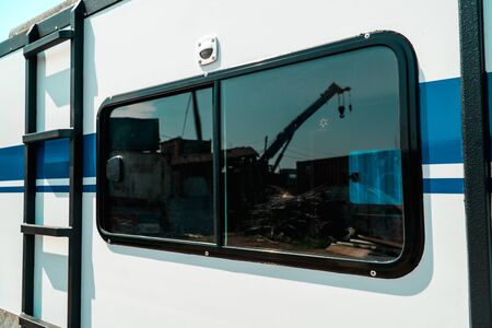 Photo of a rounded window with a black frame
Ð¾n a white wallの写真素材