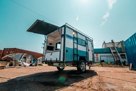 Photo of white makeshift house on wheels taken from trailerの写真素材