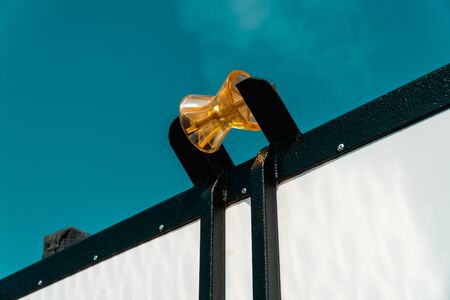 Photo of a yellow winch roller on the roof of a vanの写真素材