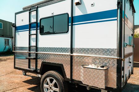 Photo of white makeshift house on wheels taken from trailerの写真素材