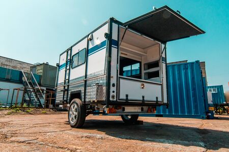 Photo of white makeshift house on wheels taken from trailerの写真素材
