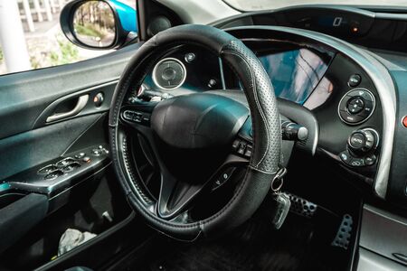 The bright photo of the dashboard in the car with black salonの写真素材