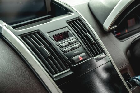 The bright photo of the dashboard in the car with black salonの写真素材