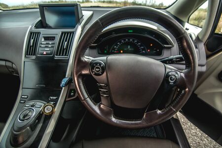 The bright photo of the dashboard in the car with black salonの写真素材