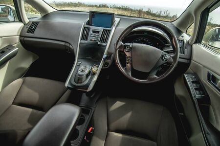 The bright photo of the dashboard in the car with black salonの写真素材