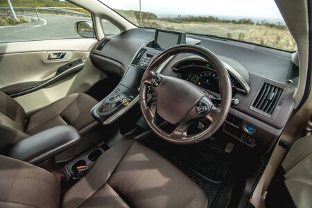 The bright photo of the dashboard in the car with black salonの写真素材