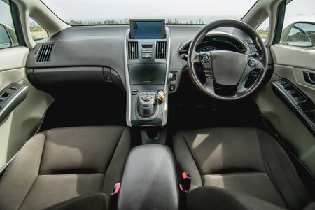 The bright photo of the dashboard in the car with black salonの写真素材