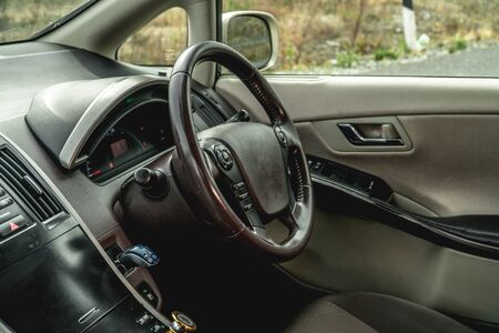 The bright photo of the dashboard in the car with black salonの写真素材