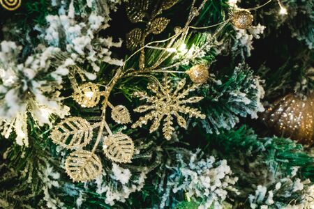 Photo of beautiful New Year toys with green tree close-upの写真素材