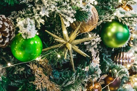 Photo of beautiful New Year toys with green tree close-upの写真素材