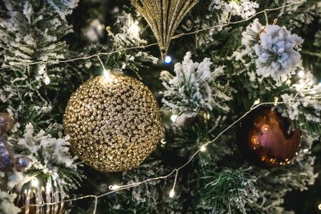 Photo of beautiful New Year toys with green tree close-upの写真素材