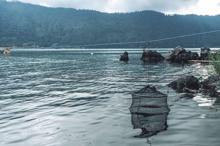 Photograph of old fish traps for fish standing in the waterの写真素材
