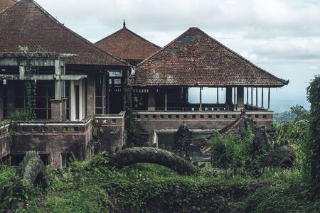 Dark photo of abandoned building with dirty walls and broken roofの写真素材