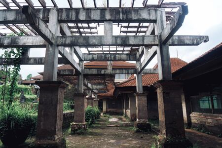 Dark photo of abandoned building with dirty walls and broken roofの写真素材