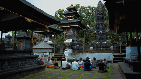 Pampatan, Rendang, Karangasem Regancy, Bali, Indonesia - July 18, 2020: Photo of people sitting in a lotus pose performing a purification ceremony in a sacred place on the island of baliのeditorial素材