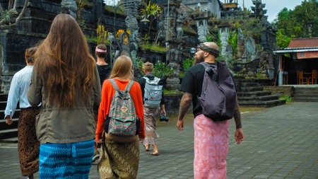 Pampatan, Rendang, Karangasem Regancy, Bali, Indonesia - July 18, 2020: Photo of people walking on the rock stears in a sacred place with ancient stone buildings on the island of baliのeditorial素材
