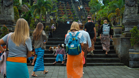 Pampatan, Rendang, Karangasem Regancy, Bali, Indonesia - July 18, 2020: Photo of people walking on the rock stears in a sacred place with ancient stone buildings on the island of baliのeditorial素材