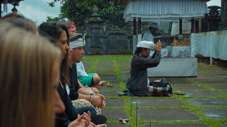 Pampatan, Rendang, Karangasem Regancy, Bali, Indonesia - July 18, 2020: Photo of people sitting in a lotus pose performing a purification ceremony in a sacred place on the island of baliのeditorial素材