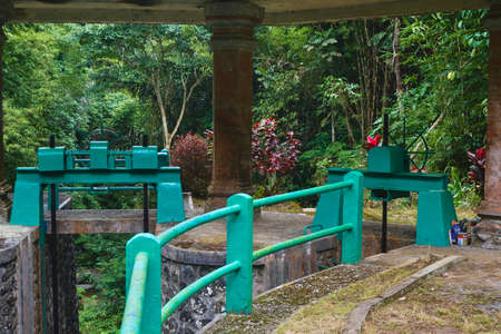 Photo of an old water dam for water supply to rice fields under a stone roof in Indonesiaの写真素材
