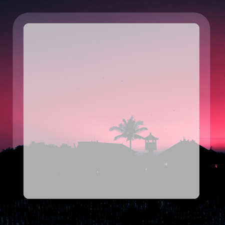 Photo of tall palm trees against a red sky with a long wooden trunk in a transparent windowの写真素材