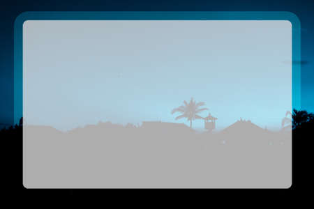 Photo of tall palm trees against a blue sky with a long wooden trunk in a transparent windowの写真素材