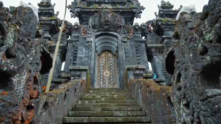 Pampatan, Rendang, Karangasem Regancy, Bali, Indonesia - July 18, 2020: Dragons and rock stairs at lampuyang temple with door on the top, at East Bali.のeditorial素材