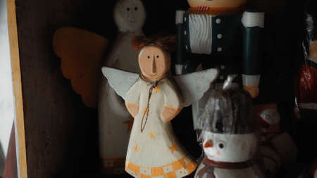Small Christmas wooden colors toys of angel standing in the houseの写真素材