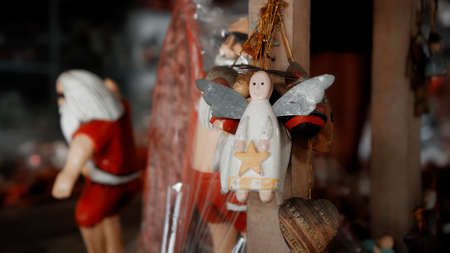 Small Christmas wooden colors toys of angel hanging in the houseの写真素材