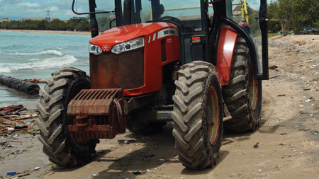 Kuta, Badung, Bali, Kuta Beach Indonesia - 4, January 2021: Tractor technic for cleaning the sea beach from garbage stands on the sand after throwing plastic garbage from the sea on the island of Bali in the city of Kutaのeditorial素材