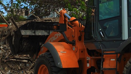 Kuta, Badung, Bali, Kuta Beach Indonesia - 4, January 2021: Tractor technic for cleaning the sea beach from garbage stands on the sand after throwing plastic garbage from the sea on the island of Bali in the city of Kutaのeditorial素材