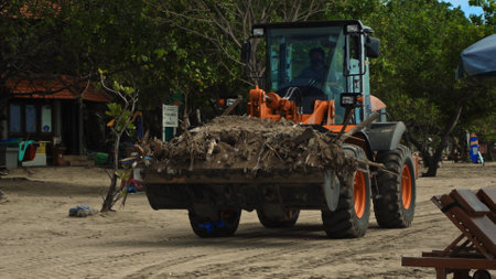 Kuta, Badung, Bali, Kuta Beach Indonesia - 4, January 2021: Tractor technic for cleaning the sea...