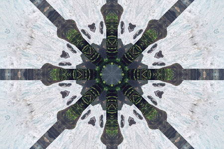 Abstract background from a repeating kaleidoscope view with gray dark and bright lines and shapes coming from the centerの写真素材