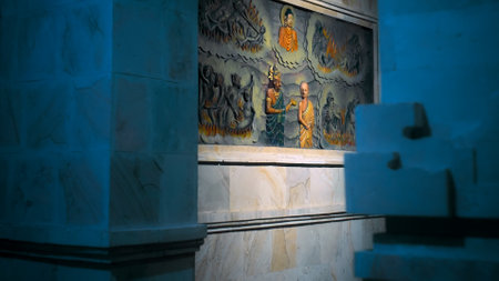 Kintamali, Bali, Indonesia - 05, July 2022: A painting on a wall in a Buddhist temple with a buddha and the history of his arrival and lifeのeditorial素材