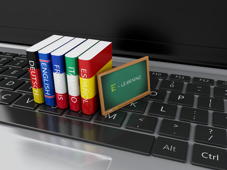 3d illustration. Dictionaries and blackboard on computer keyboard. E-learning. Languages learn and translate, education concept.の写真素材
